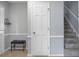 Hallway featuring tile floor, neutral paint, and staircase leading to the upper level at 211 Bramblewood Dr, Summerville, SC 29485