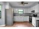 Functional kitchen with white cabinets, stainless steel appliances, and ample counter space at 211 Bramblewood Dr, Summerville, SC 29485
