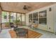 Relaxing screened back porch featuring a ceiling fan and comfortable seating area at 2154 Country Manor Dr Dr, Mount Pleasant, SC 29466