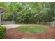 Spacious backyard with lush green grass, a patio, and mature trees, perfect for outdoor enjoyment at 2154 Country Manor Dr Dr, Mount Pleasant, SC 29466