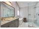 Bathroom featuring double vanity, soaking tub, and walk-in shower with frameless glass at 2154 Country Manor Dr Dr, Mount Pleasant, SC 29466