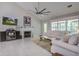 Cozy living room with a fireplace, tile floors, and a door that leads to an outdoor area at 2154 Country Manor Dr Dr, Mount Pleasant, SC 29466
