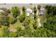 Aerial view of a property with mature trees, multiple buildings, and green space at 21785 Lowcountry Hwy, Ruffin, SC 29475