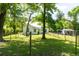 Spacious fenced backyard featuring lush greenery and a charming vintage house backdrop at 21785 Lowcountry Hwy, Ruffin, SC 29475