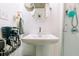 Bright bathroom with a pedestal sink, mirror, and shower stall with clear glass doors at 21785 Lowcountry Hwy, Ruffin, SC 29475