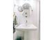 Pedestal sink with modern fixtures in a bright bathroom with a shower enclosure at 21785 Lowcountry Hwy, Ruffin, SC 29475