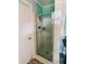 Bathroom features a shower with glass doors, and blue horizontal planking at 21785 Lowcountry Hwy, Ruffin, SC 29475