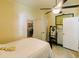 Bedroom with original wood flooring, a ceiling fan, antique décor, and a charming full-length mirror at 21785 Lowcountry Hwy, Ruffin, SC 29475