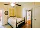 Cozy bedroom featuring a ceiling fan, original wood flooring, and a comfortable antique bed at 21785 Lowcountry Hwy, Ruffin, SC 29475