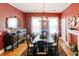 Elegant dining room featuring rustic table, decorative fireplace, and dark-wood furniture at 21785 Lowcountry Hwy, Ruffin, SC 29475