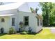 Corner detail of the home with well-maintained siding, garden, and roofline; classic design and pleasant curb appeal at 21785 Lowcountry Hwy, Ruffin, SC 29475