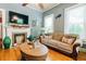 Comfortable living room with hardwood floors, fireplace, and a relaxing sofa area at 21785 Lowcountry Hwy, Ruffin, SC 29475