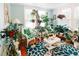 Bright living room with large windows, an abundance of plants, and comfortable seating at 21785 Lowcountry Hwy, Ruffin, SC 29475