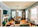 Bright living room featuring hardwood floors, a cozy fireplace, and abundant natural light at 21785 Lowcountry Hwy, Ruffin, SC 29475