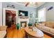 Cozy living room with hardwood floors, a fireplace, and comfortable seating at 21785 Lowcountry Hwy, Ruffin, SC 29475