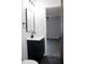 A small bathroom vanity with a black faucet, mirror, and hexagon tile floor at 227 Amy Dr, Goose Creek, SC 29445