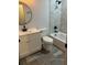 This bathroom has updated tiling in the shower, modern fixtures, and white cabinets at 227 Amy Dr, Goose Creek, SC 29445
