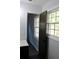 Bathroom doorway and vanity with black hardware, mirror, and hexagon floor tile at 227 Amy Dr, Goose Creek, SC 29445