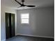 This bedroom features updated flooring, a modern ceiling fan, and fresh gray paint at 227 Amy Dr, Goose Creek, SC 29445