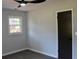 Bedroom with new gray laminate flooring, a window with natural light, and a dark interior door at 227 Amy Dr, Goose Creek, SC 29445