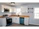 Beautiful updated kitchen features butcher block counters, white cabinets, and new appliances at 227 Amy Dr, Goose Creek, SC 29445