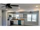 Open-concept kitchen with butcher block counters, stainless appliances, white cabinets, and modern lighting fixtures at 227 Amy Dr, Goose Creek, SC 29445