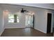 Bright living room featuring stylish gray walls, modern ceiling fan, and durable wood-look flooring at 227 Amy Dr, Goose Creek, SC 29445
