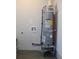 A new AO Smith water heater featuring red and blue water lines, and mounted on a metal stand at 227 Amy Dr, Goose Creek, SC 29445