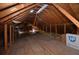 Unfinished attic featuring exposed wood beams, perfect for storage or future expansion at 2300 Bethera Rd # B, Bonneau, SC 29431