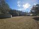 Sprawling backyard, metal outbuilding and wooded area in the distance at 2300 Bethera Rd # B, Bonneau, SC 29431