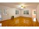 Spacious living room with hardwood floors, many windows, and neutral-colored walls at 2300 Bethera Rd # B, Bonneau, SC 29431