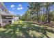 Expansive backyard featuring lush green grass, mature trees, and a sense of privacy at 254 Cypress Marsh Rd, Moncks Corner, SC 29461