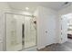 Bathroom featuring a glass-enclosed shower and open doorway to bedroom at 254 Cypress Marsh Rd, Moncks Corner, SC 29461
