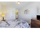Bright bedroom features an ornate bedspread, closet, and elegant wall decorations at 254 Cypress Marsh Rd, Moncks Corner, SC 29461