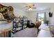 Multi-purpose room with a ceiling fan, desk, chair, window, and organized shelving at 254 Cypress Marsh Rd, Moncks Corner, SC 29461