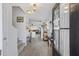 Warm and inviting foyer with hardwood flooring, staircase, and a glimpse of the cozy living spaces beyond at 254 Cypress Marsh Rd, Moncks Corner, SC 29461