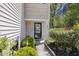 Welcoming front entryway with lush greenery, decorative touches, and a charming path, inviting you inside at 254 Cypress Marsh Rd, Moncks Corner, SC 29461