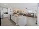 Open kitchen with granite countertops island seamlessly connects to the living area at 254 Cypress Marsh Rd, Moncks Corner, SC 29461