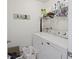 Functional laundry room with modern washer and dryer, storage shelves, and accessories at 254 Cypress Marsh Rd, Moncks Corner, SC 29461