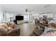 Open-concept living area with a ceiling fan, with a view into a well-equipped kitchen at 254 Cypress Marsh Rd, Moncks Corner, SC 29461