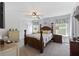Main bedroom with a four-poster bed, ceiling fan and lots of natural light at 254 Cypress Marsh Rd, Moncks Corner, SC 29461