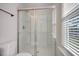 Bright bathroom featuring a glass-enclosed shower with a modern showerhead and fixtures at 2606 Bennett Yard Rd, North Charleston, SC 29405