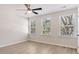 This bedroom is bright and spacious, featuring multiple windows that provide ample natural light at 2606 Bennett Yard Rd, North Charleston, SC 29405