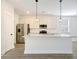 Modern kitchen boasts stainless steel appliances, granite countertops, and a large island at 2606 Bennett Yard Rd, North Charleston, SC 29405