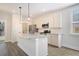 Contemporary kitchen featuring an island with granite countertops and stainless steel appliances at 2606 Bennett Yard Rd, North Charleston, SC 29405