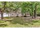 Spacious backyard with mature trees providing ample shade for outdoor enjoyment and relaxation at 2919 Fernwood Dr, North Charleston, SC 29406
