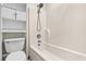 Clean and well-maintained bathroom with white fixtures, a shower-tub combination and storage at 2919 Fernwood Dr, North Charleston, SC 29406