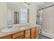 Bright bathroom with double sinks and a large mirror over the vanity and a shower with a shower curtain at 2919 Fernwood Dr, North Charleston, SC 29406