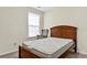 Cozy bedroom featuring a comfortable mattress and a classic rocking chair by the window at 2919 Fernwood Dr, North Charleston, SC 29406