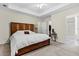 Spacious bedroom with trey ceiling and neutral walls offers a view of an ensuite bathroom and walk-in closet at 2919 Fernwood Dr, North Charleston, SC 29406